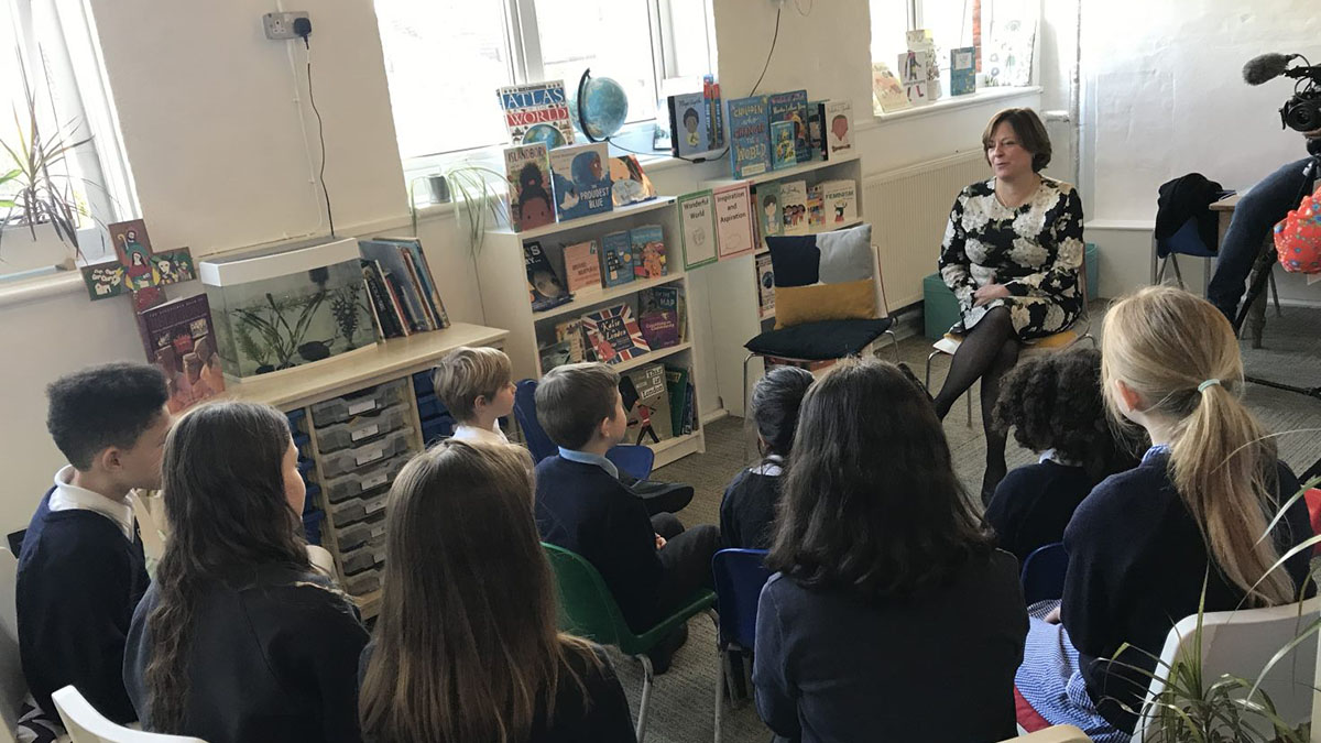 Dame Melanie Dawes talks to a group of pupils at St John's and St Clement's Primary School in south east London.
