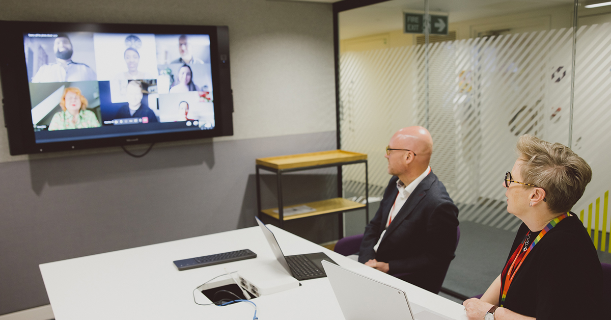 Video call with colleagues in meeting room 