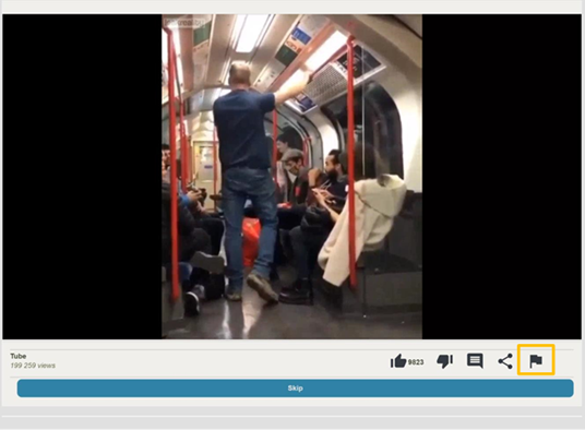 User interface with a man in the tube video playing. The report function is displayed as a flag icon on the top-level of functions.