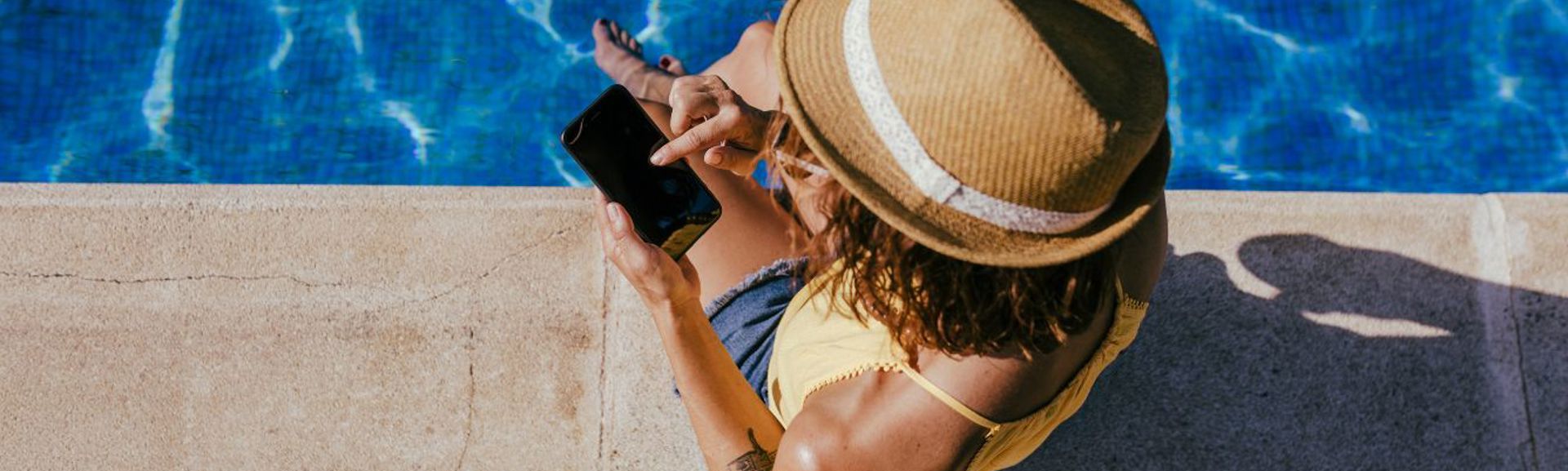 Holidaymaker looking at mobile phone