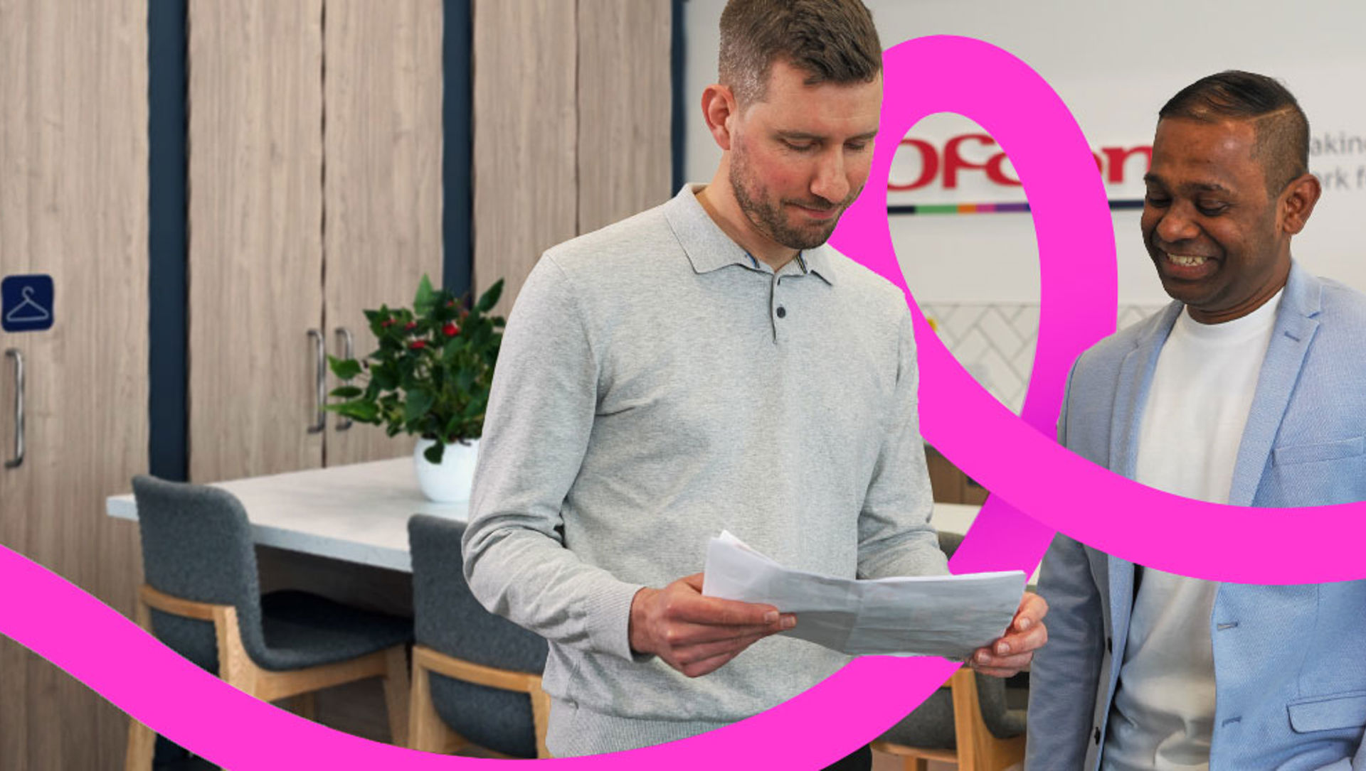 Two Ofcom colleagues discussing their work