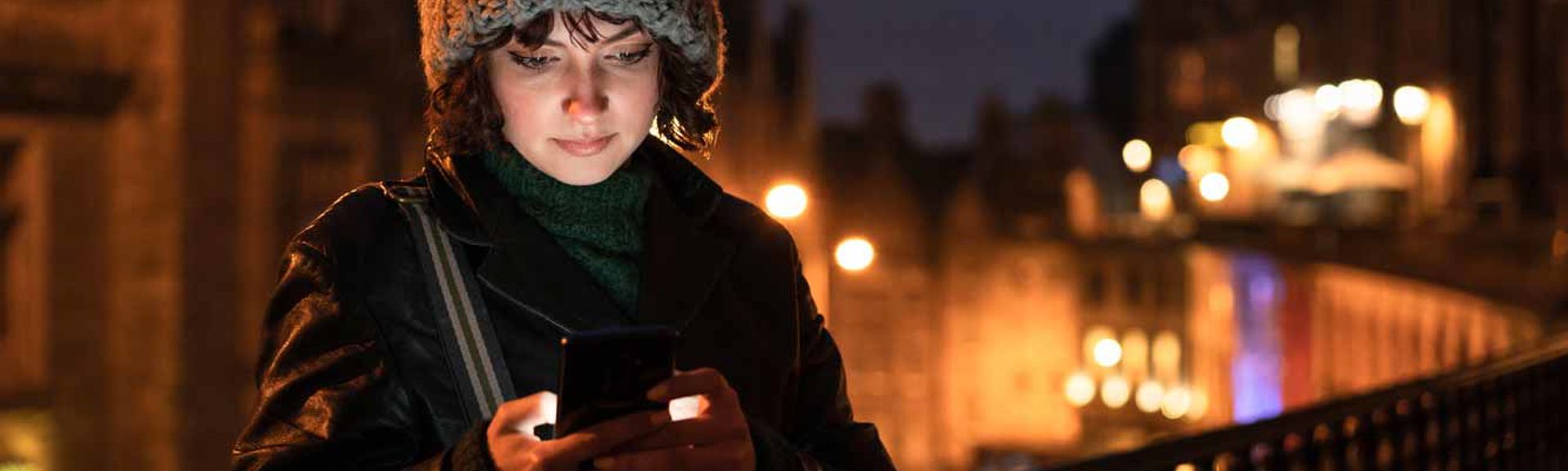 A woman using a mobile phone in Edinburgh