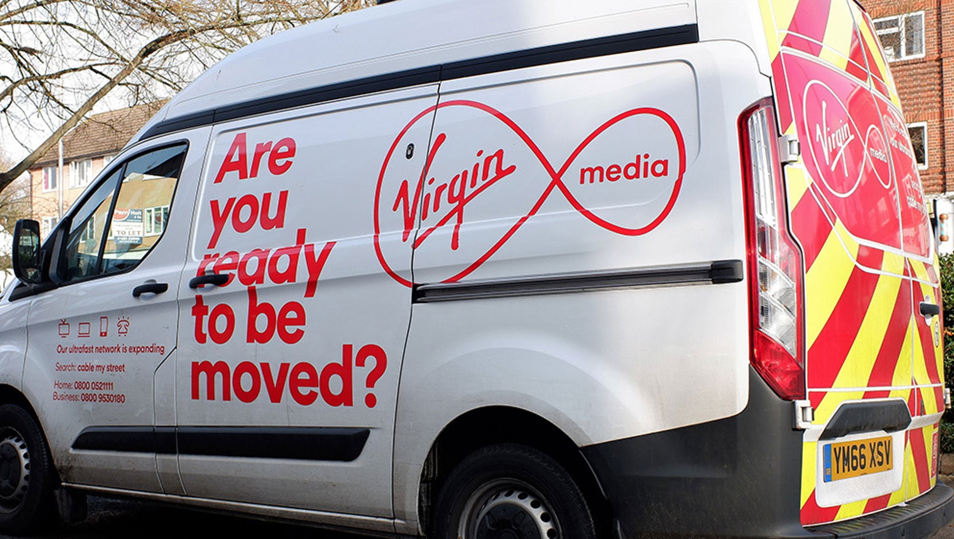 A Virgin Media van parked on a residential street