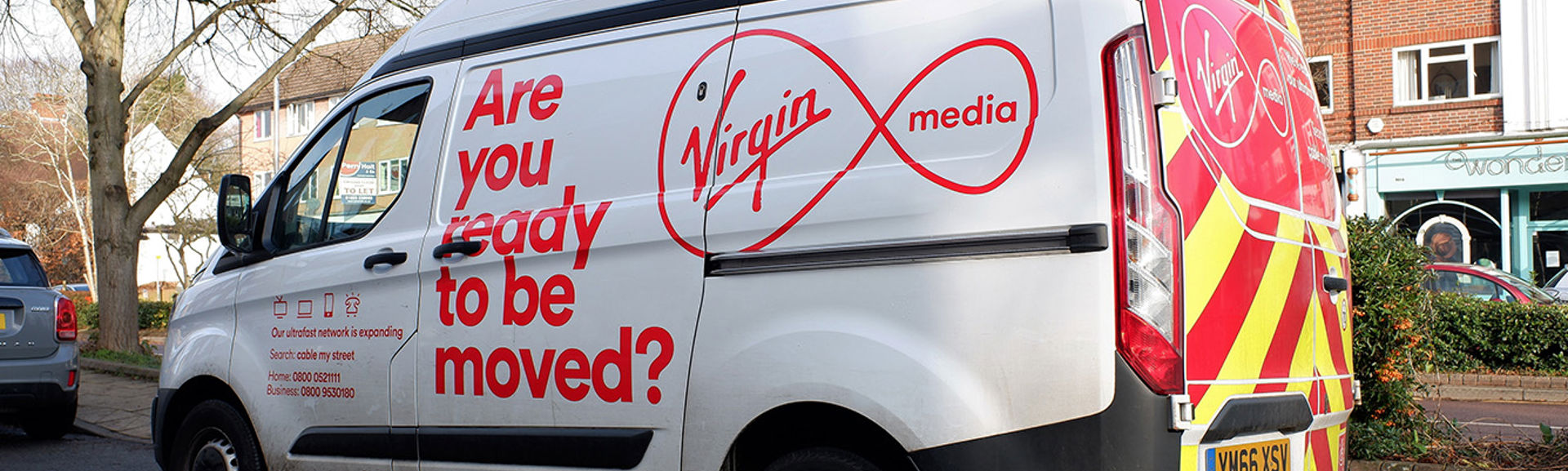 A Virgin Media van parked on a residential street