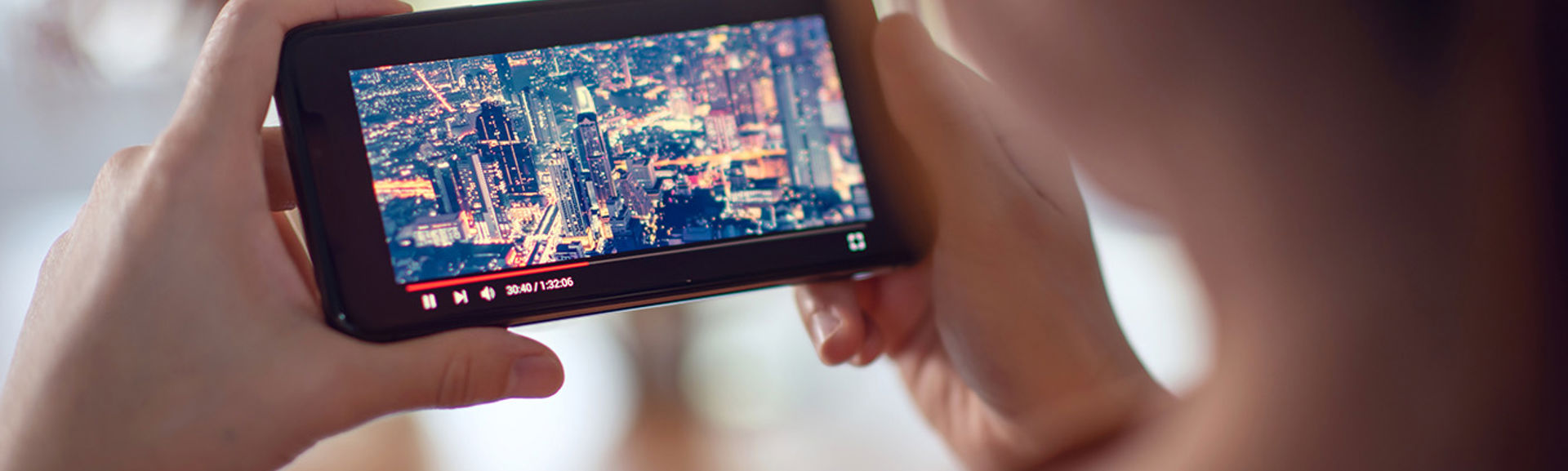 Young person watching a video on a mobile phone 
