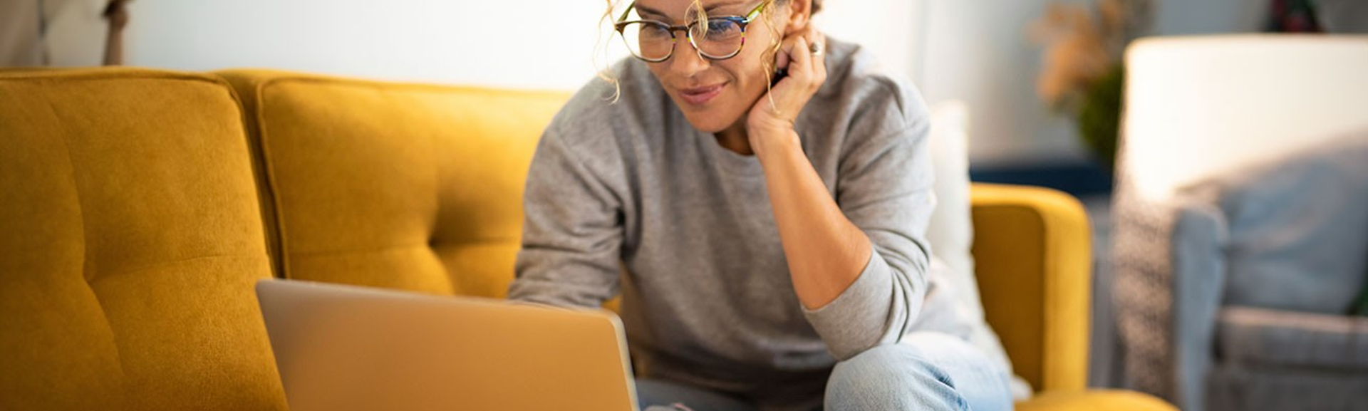 Woman in home setting using laptop