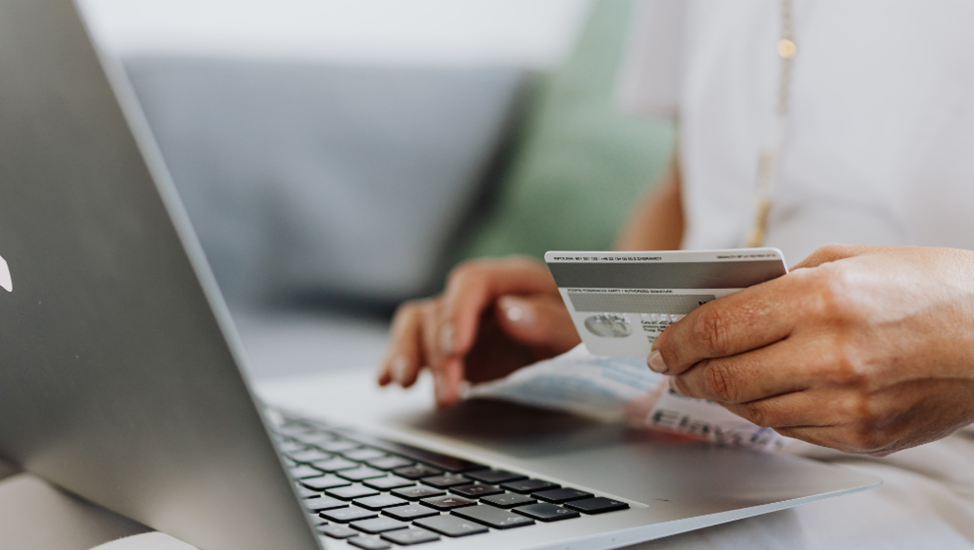 Bank card and laptop hero