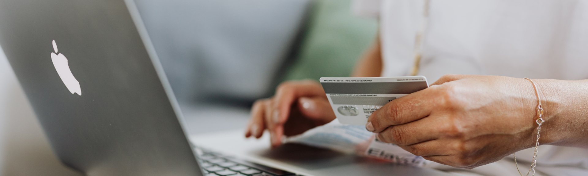 Bank card and laptop hero