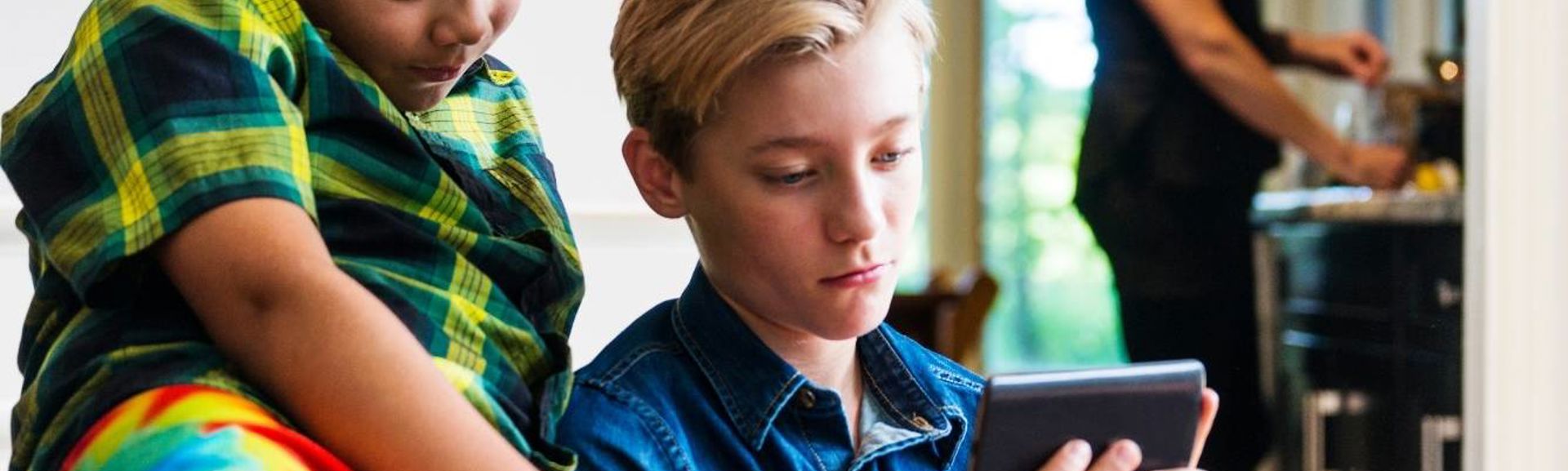 Children watching mobile phone