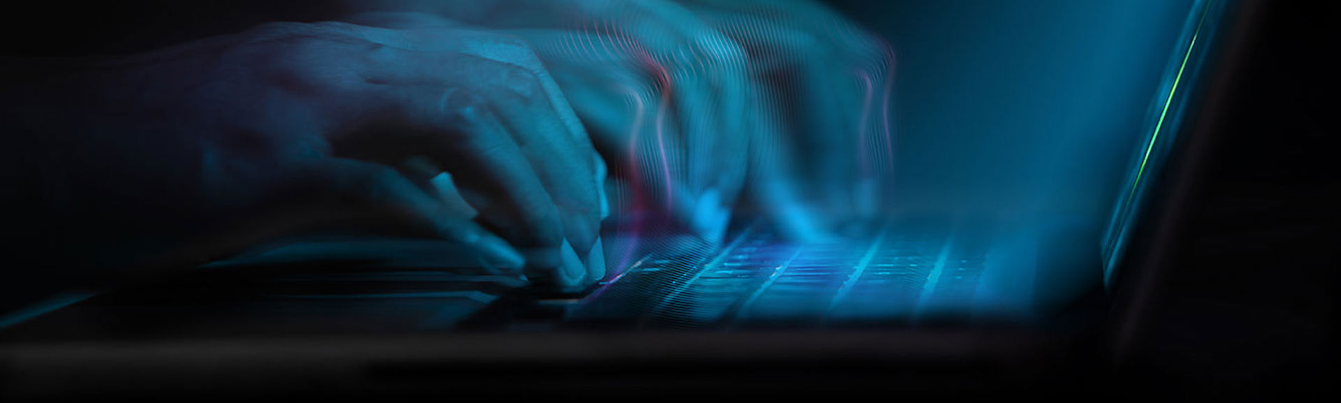 An abstract image of hands typing on a keyboard