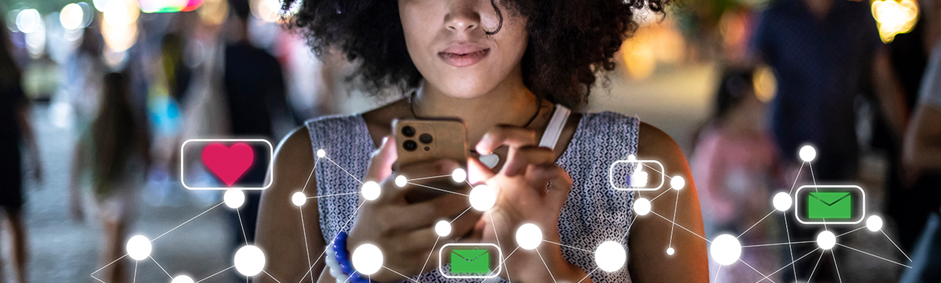Young woman using her mobile phone in the evening