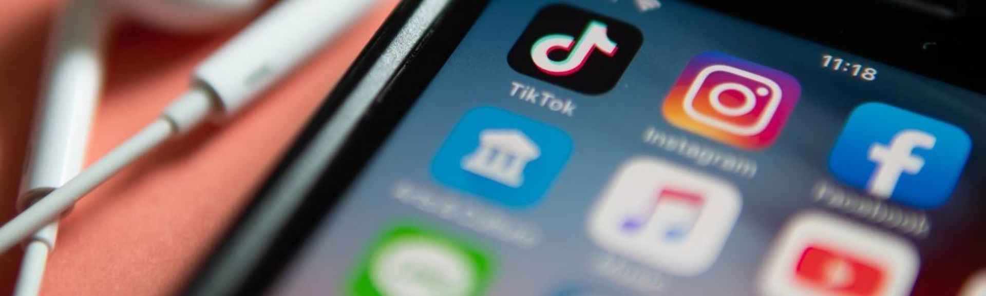 Smartphone screen showing TikTok and other social media app icons