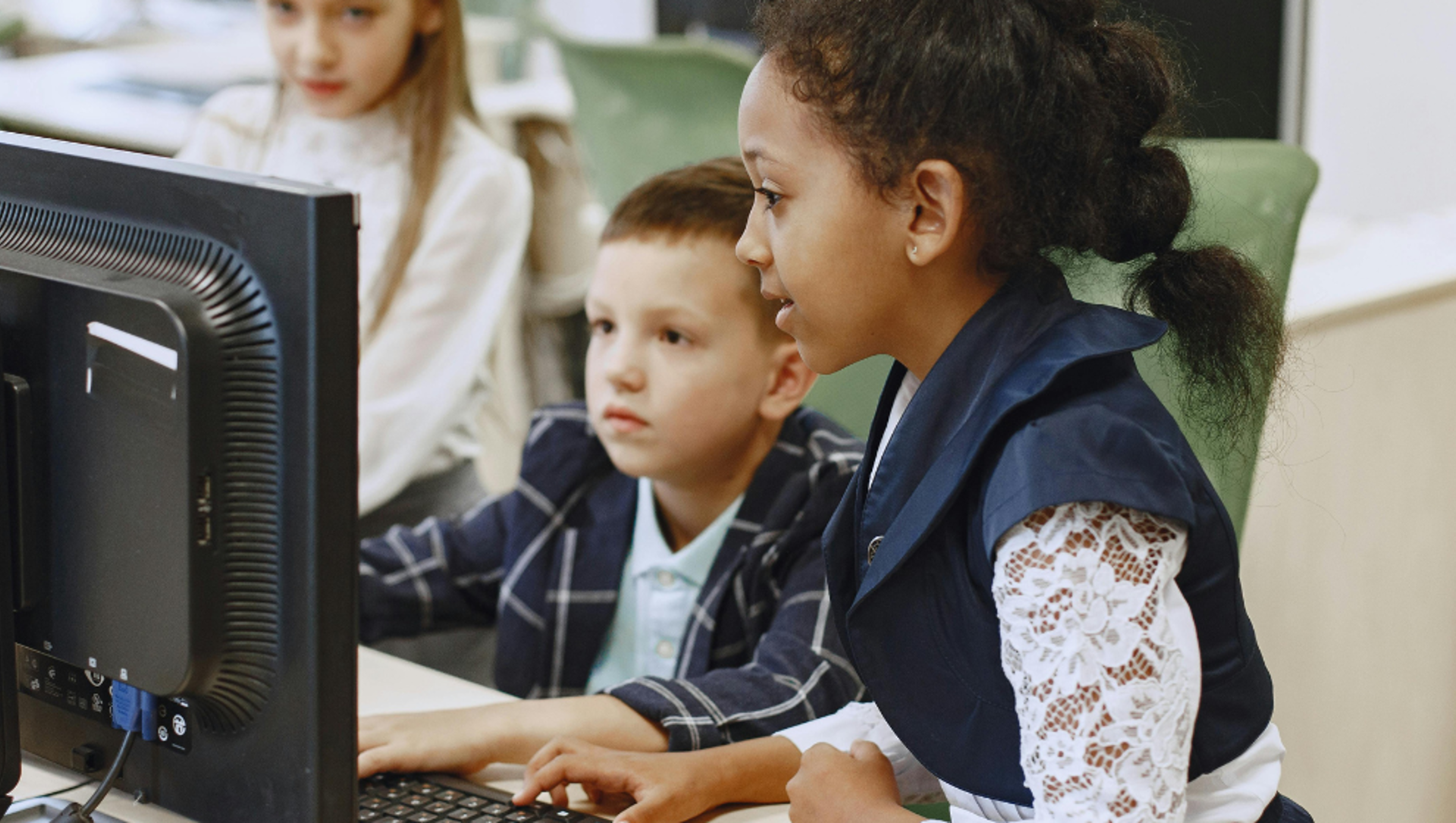 young children on computer hero