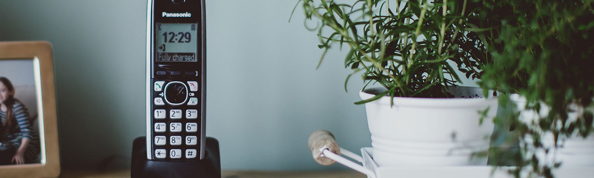 Cordless landline phone on a desk
