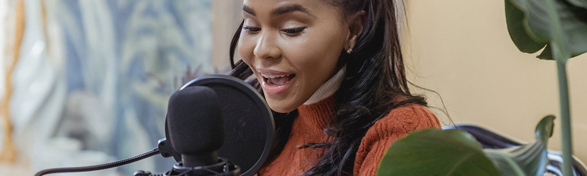 Young woman talking into a microphone