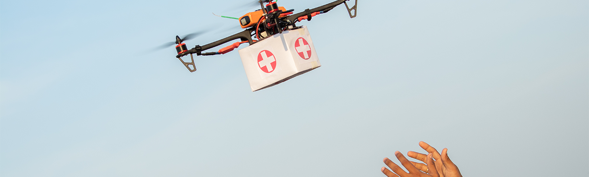 Drone Delivering First Aid Box or medicine to costumer hand