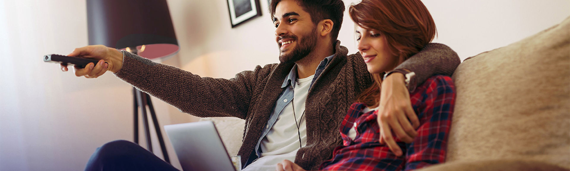Two people watching television together