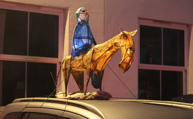 Donkey and Mary on the roof of a car