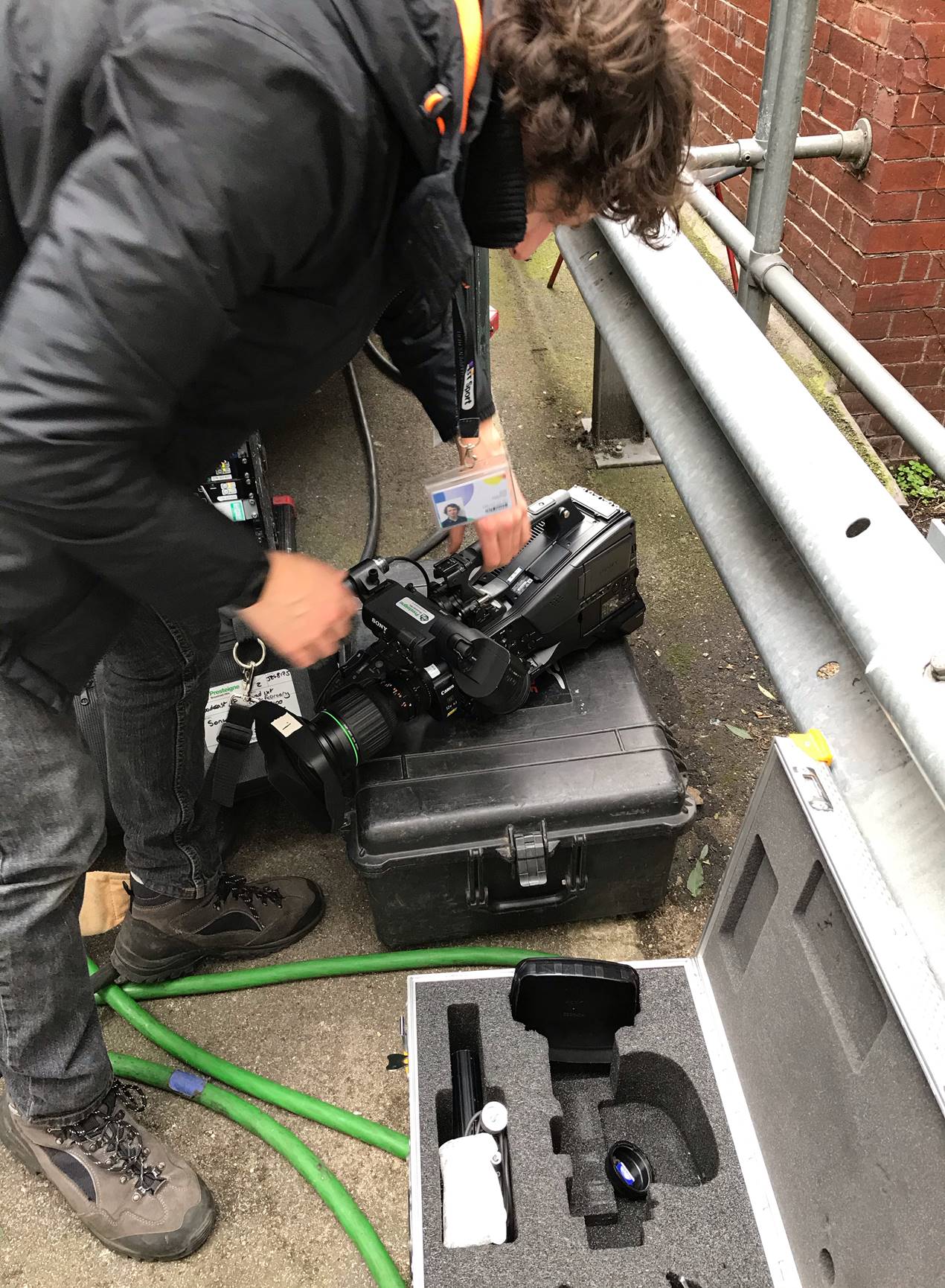 Man unpacking camera equipment