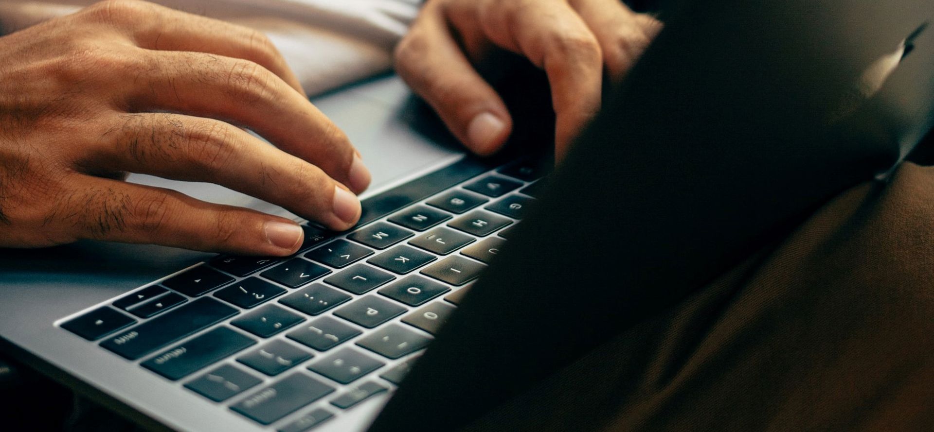 man-sitting-laptop-in-lap-square